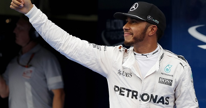 Mercedes driver Lewis Hamilton of Britain gestures as he celebrates after taking pole position during qualifying for the Malaysian Formula One Grand Prix at the Sepang International Circuit in Sepang, Malaysia, Saturday, Oct. 1, 2016. (AP Photo/Vincent Thian)