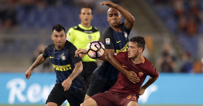 Roma’s Alessandro Florenzi, right, and Inter Milan’s Joao Mario vie for the ball during a Serie A soccer match at Rome's Olympic Stadium, Sunday, Oct. 2, 2016. (AP Photo/Andrew Medichini)