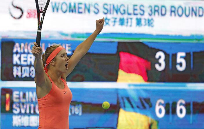 Elina Svitolina of Ukraine celebrates after defeating Angelique Kerber of Germany in the women's singles match of the China Open tennis tournament at the Diamond Court in Beijing, Thursday, Oct. 6, 2016. (AP Photo/Andy Wong)