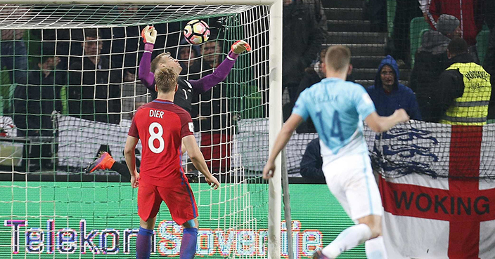 England goalkeeper Joe Hart, second left, makes a save during the World Cup Group F qualifying soccer match between Slovenia and England, at Stozice stadium in Ljubljana, Slovenia, Tuesday, Oct. 11, 2016. (AP Photo/Darko Bandic)