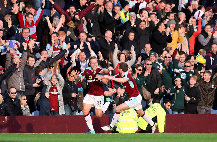 Burnley's Scott Arfield, left, celebrates scoring his side's second goal against Everton during the English Premier League soccer match at Turf Moor, Burnley, England, Saturday, Oct. 22, 2016. (Martin Rickett/PA via AP)