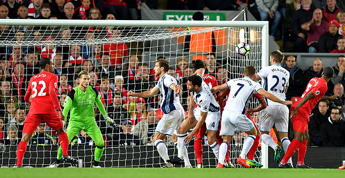 West Bromwich Albion's Gareth McAuley, second right, scores against Liverpool during the English Premier League soccer match at Anfield, Liverpool, England, Saturday Oct. 22, 2016. (Dave Howarth/PA via AP)