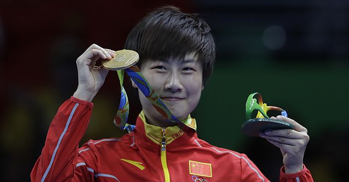 Women's singles table tennis gold medalist Ding Ning, of China, poses with her medal during the 2016 Summer Olympics in Rio de Janeiro, Brazil, Wednesday, Aug. 10, 2016. (AP Photo/Petros Giannakouris)