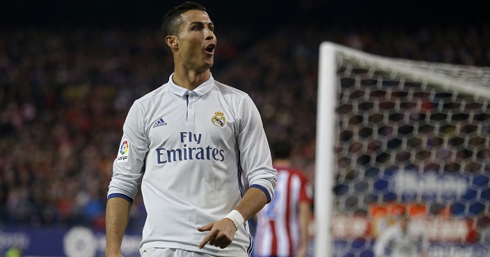 Real Madrid's Cristiano Ronaldo celebrates after scoring his side's third goal against Atletico Madrid during a Spanish La Liga soccer match between Real Madrid and Atletico Madrid at the Vicente Calderon stadium in Madrid, Saturday, Nov. 19, 2016. Ronaldo scored a hat trick in Real Madrid 3-0 victory. (AP Photo/Francisco Seco)