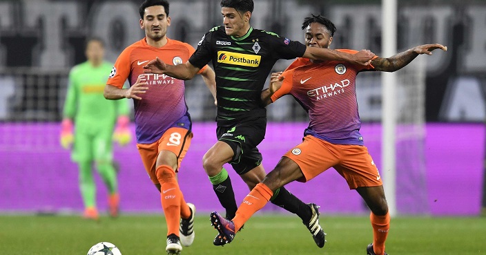 Moenchengladbach's Mahmoud Dahoud, centre, is challenged by Manchester City's Raheem Sterling, right, and Ilkay Gundogan during the Champions League Group C soccer match between Borussia Moenchengladbach and Manchester City in Moenchengladbach, Germany, Wednesday, Nov. 23, 2016. (AP Photo/Martin Meissner)