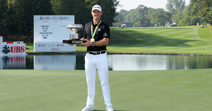 HONG KONG - DECEMBER 07:  Defending champion, Justin Rose of England poses with the UBS Hong Kong Open trophy and his Olympic gold medal ahead of the UBS Hong Kong Open at The Hong Kong Golf Club on December 7, 2016 in Hong Kong, Hong Kong.  (Photo by Warren Little/Getty Images)