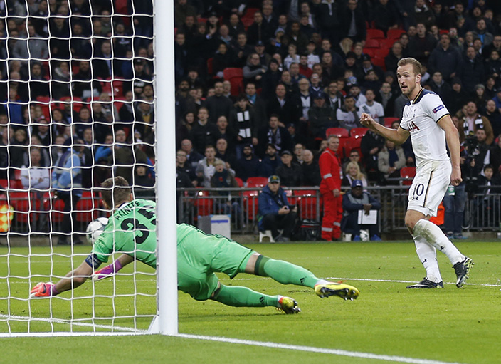 Tottenham's Harry Kane, right, scores his side's 2nd goal past CSKA goalkeeper Igor Akinfeev during the Champions League group E soccer match between Tottenham Hotspur and CSKA Moscow at Wembley stadium in London, Wednesday, Dec. 7, 2016. (AP Photo/Frank Augstein)