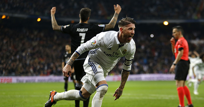 Real Madrid's Sergio Ramos celebrates after scoring the the winning goal against Deportivo during a Spanish La Liga soccer match between Real Madrid and Deportivo Coruna at the Santiago Bernabeu stadium in Madrid, Saturday, Dec. 10, 2016. Ramos scored once in Real Madrid's 3-2 victory. (AP Photo/Francisco Seco)