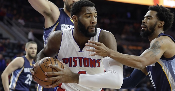 Memphis Grizzlies guard Mike Conley, right, reaches in on Detroit Pistons center Andre Drummond during the first half of an NBA basketball game, Wednesday, Dec. 21, 2016 in Auburn Hills, Mich. (AP Photo/Carlos Osorio)