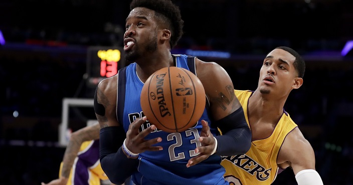 Dallas Mavericks guard Wesley Matthews drives to the basket past Los Angeles Lakers guard Jordan Clarkson during the first half of an NBA basketball game in Los Angeles, Thursday, Dec. 29, 2016. (AP Photo/Chris Carlson)