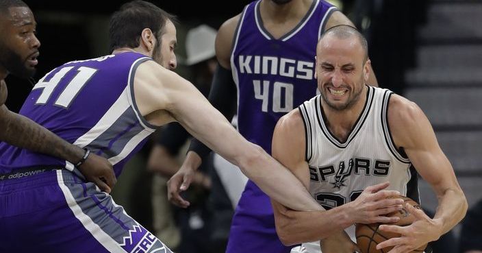 Sacramento Kings center Kosta Koufos (41) tries to strip the ball from San Antonio Spurs guard Manu Ginobili (20) during the second half of an NBA basketball game, Wednesday, March 8, 2017, in San Antonio. The Spurs won 114-104. (AP Photo/Eric Gay)