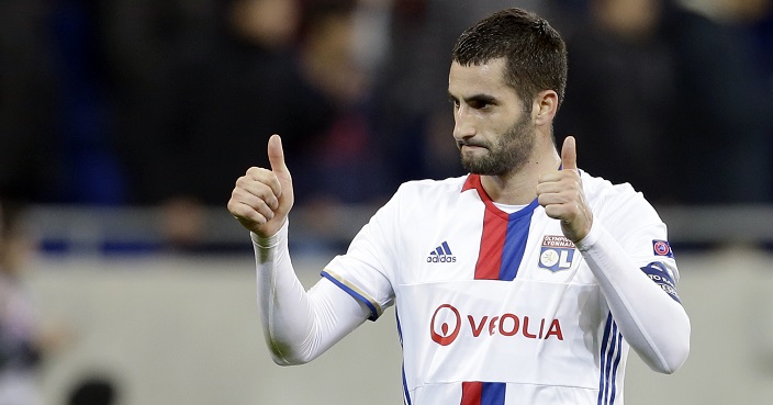 Lyon's Maxime Gonalons cheers to supporters after his team's victory at the end of his Europa League round of 16 first leg soccer match against Roma in Decines, near Lyon, central France, Thursday, March 9, 2017. (AP Photo/Claude Paris)