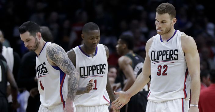 Los Angeles Clippers guard J.J. Redick, guard Jamal Crawford and forward Blake Griffin, from left, react to the team's 97-96 loss to the Milwaukee Bucks during an NBA basketball game in Los Angeles, Wednesday, March 15, 2017. (AP Photo/Chris Carlson)