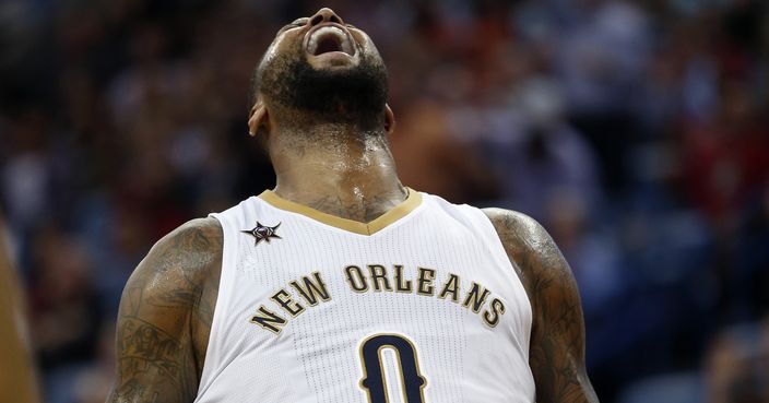 New Orleans Pelicans forward DeMarcus Cousins (0) reacts after being fouled while scoring in the second half of an NBA basketball game against the Memphis Grizzlies in New Orleans, Tuesday, March 21, 2017. The Pelicans won 95-82. (AP Photo/Gerald Herbert)