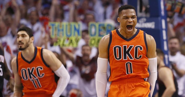 Oklahoma City Thunder guard Russell Westbrook (0) shouts following a dunk by teammate Enes Kanter (11) in the first half of Game 4 of a first-round NBA basketball playoff series in Oklahoma City, Sunday, April 23, 2017. (AP Photo/Sue Ogrocki)