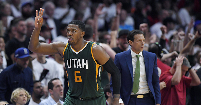 Utah Jazz forward Joe Johnson, left, celebrates after making a 3-point shot as coach Quin Snyder stands nearby during the second half in Game 5 of the team'sp NBA basketball first-round playoff series against the Los Angeles Clippers, Tuesday, April 25, 2017, in Los Angeles. The Jazz won 96-92. (AP Photo/Mark J. Terrill)