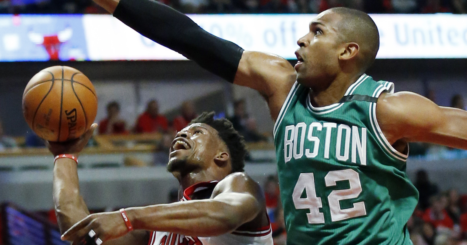 Chicago Bulls' Jimmy Butler, left, drives to the basket against Boston Celtics' Al Horford during the first half in Game 6 of an NBA basketball first-round playoff series, Friday, April. 28, 2017, in Chicago. (AP Photo/Nam Y. Huh)