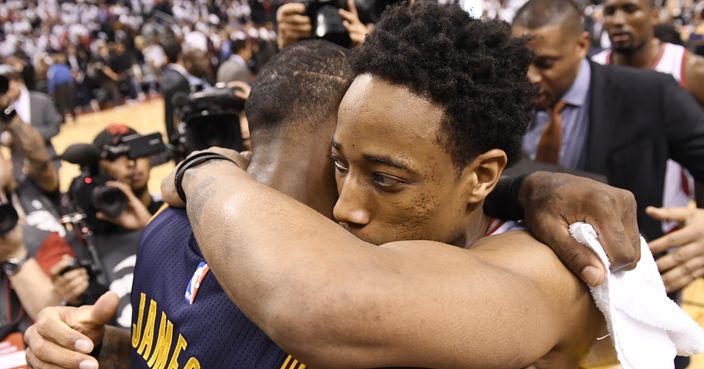 Toronto Raptors guard DeMar DeRozan, right, hugs Cleveland Cavaliers forward LeBron James (23) after the Cavaliers won Game 4 of a second-round NBA basketball playoff series in Toronto, Sunday, May 7, 2017. (Frank Gunn/The Canadian Press via AP)