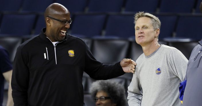 Golden State Warriors head coach Steve Kerr, right, talks with interim head coach Mike Brown during an NBA basketball practice, Wednesday, May 31, 2017, in Oakland, Calif. The Golden State Warriors face the Cleveland Cavaliers in Game 1 of the NBA Finals on Thursday in Oakland. (AP Photo/Marcio Jose Sanchez)