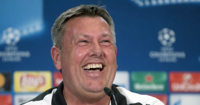 FILE - A Tuesday April 11, 2017 file photo of Leicester coach Craig Shakespeare laughing during a press conference at the Vicente Calderon stadium in Madrid, Spain. Leicester has hired Craig Shakespeare as its permanent manager on a three-year deal after his successful interim spell in charge of the 2015-16 Premier League champion. Shakespeare replaced title-winning manager Claudio Ranieri in February on a short-term deal and won eight of his 16 games, helping Leicester pull clear of the league’s relegation zone. (AP Photo/Paul White, File)