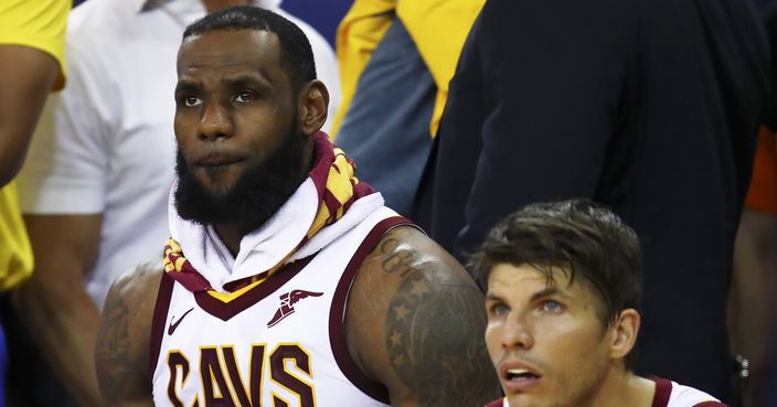 Cleveland Cavaliers forward LeBron James, left, sits on the bench with guard Kyle Korver during the second half of Game 2 of basketball's NBA Finals against the Golden State Warriors in Oakland, Calif., Sunday, June 3, 2018. The Warriors won 122-103. (AP Photo/Ben Margot)