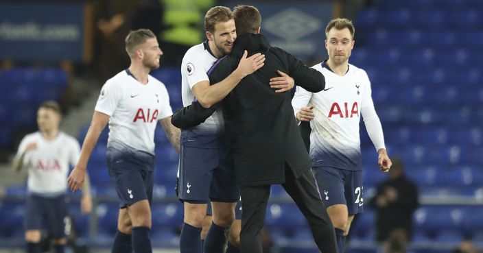 Tottenham's Harry Kane, left, hugs Tottenham coach Mauricio Pochettino at the end of the English Premier League soccer match between Everton and Tottenham at Goodison Park Stadium, in Liverpool, England, Sunday, Dec. 23, 2018. (AP Photo/Jon Super)